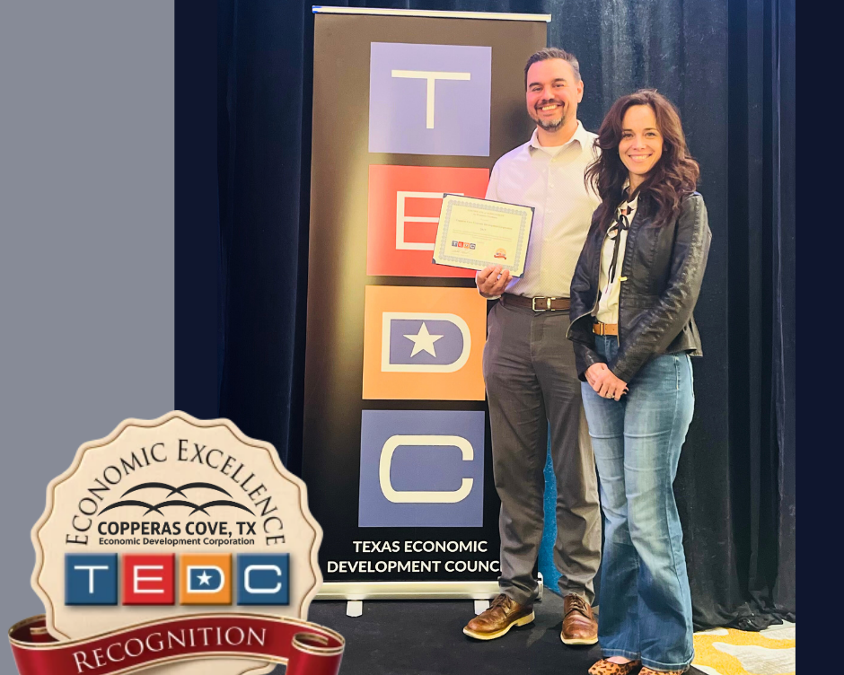 Sean Stevens and Anne Seneca accept the Economic Excellence Award for CCEDC.