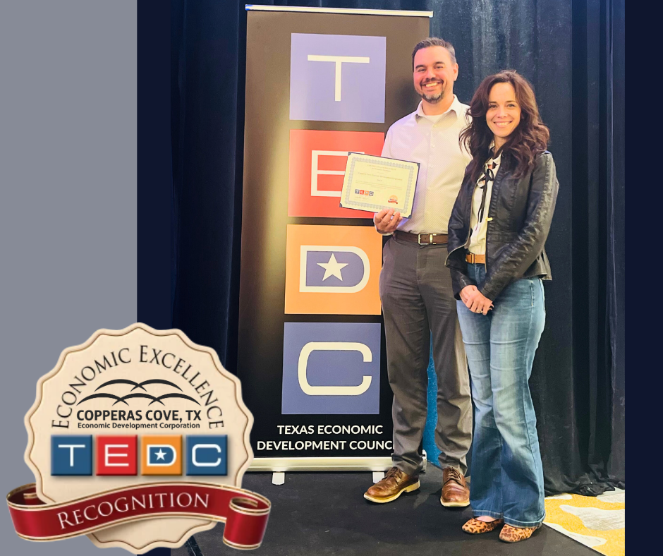 Sean Stevens and Anne Seneca accept the Economic Excellence Award for CCEDC.