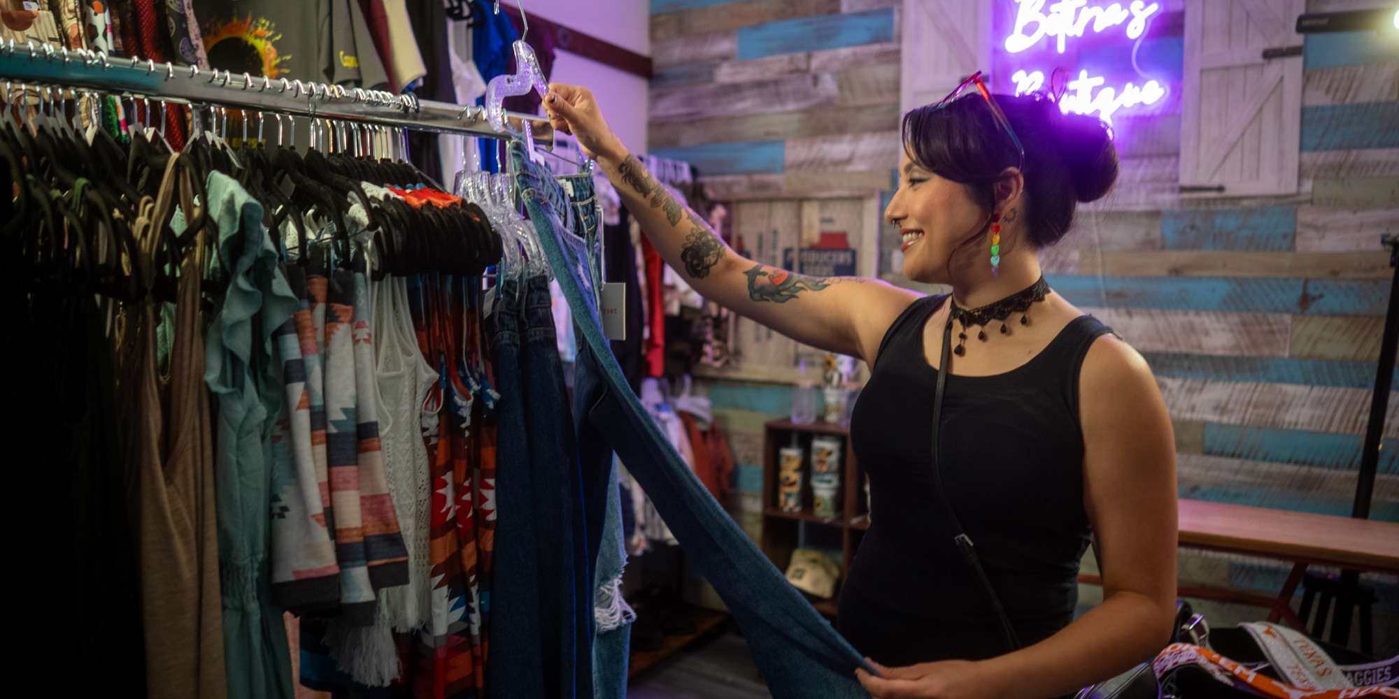woman looking at clothes at a boutique