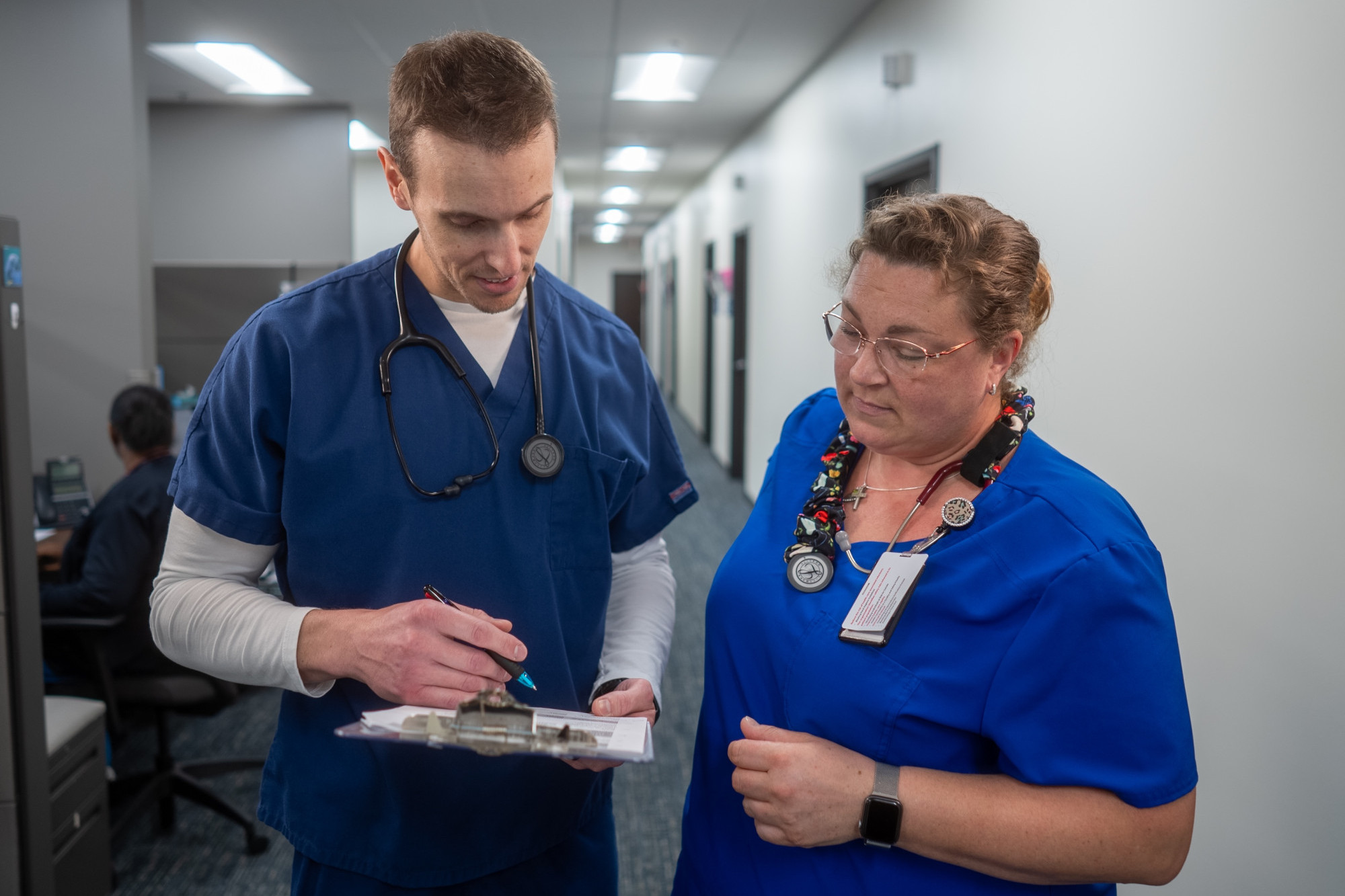 healthcare workers reviewing a chart