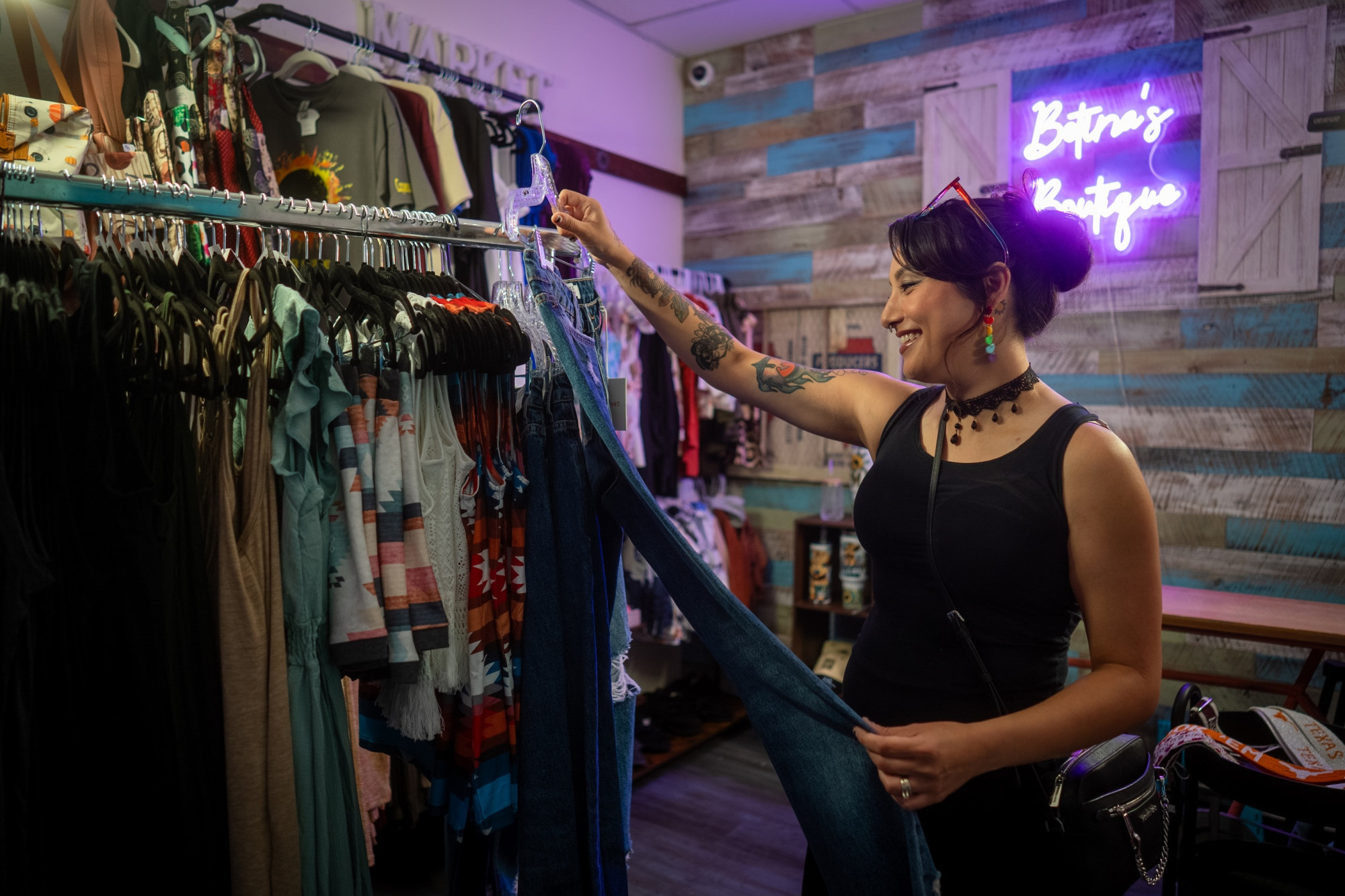 woman looking at clothes at a boutique