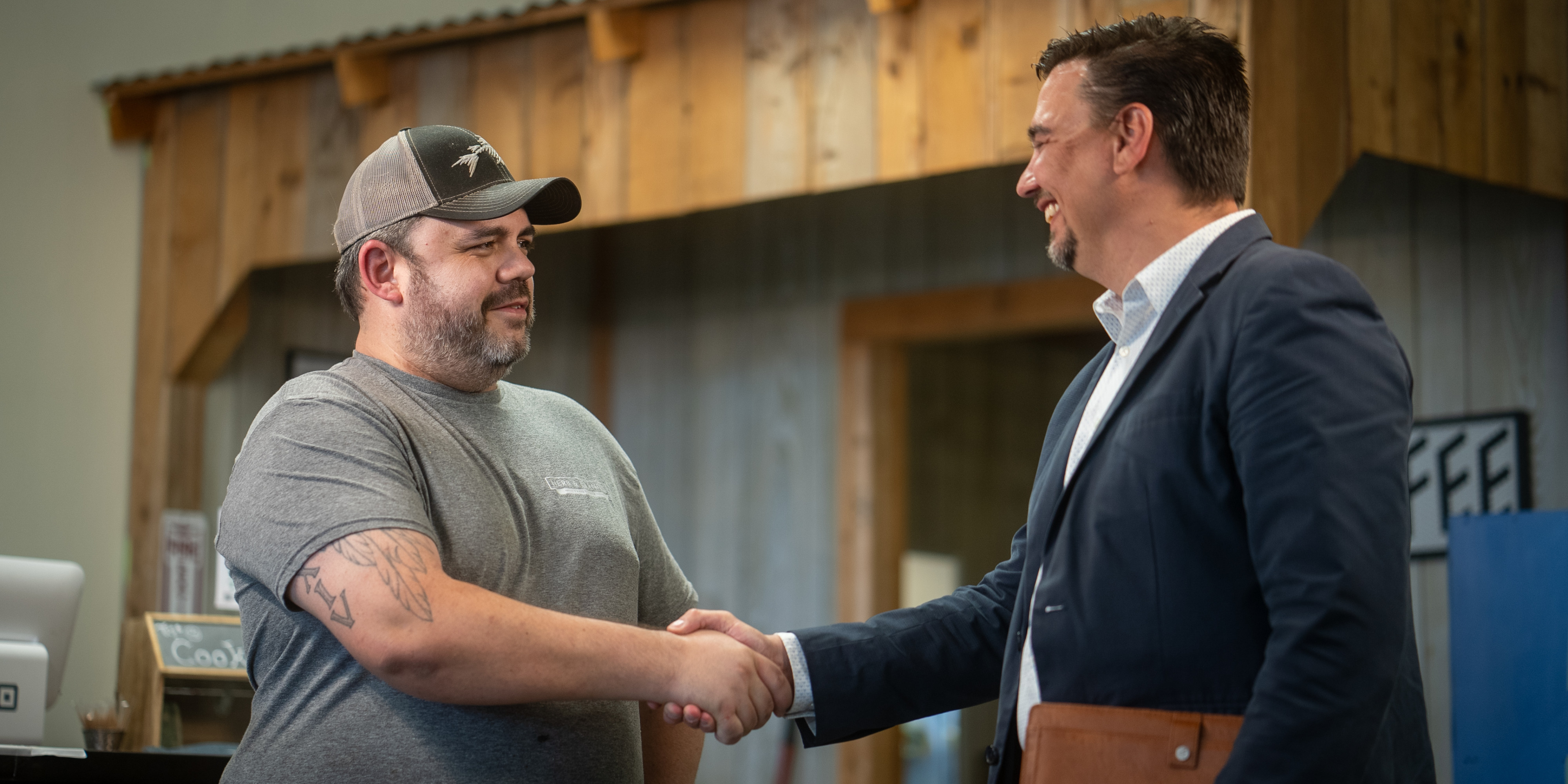 business owner shaking hands with a CCEDC team member