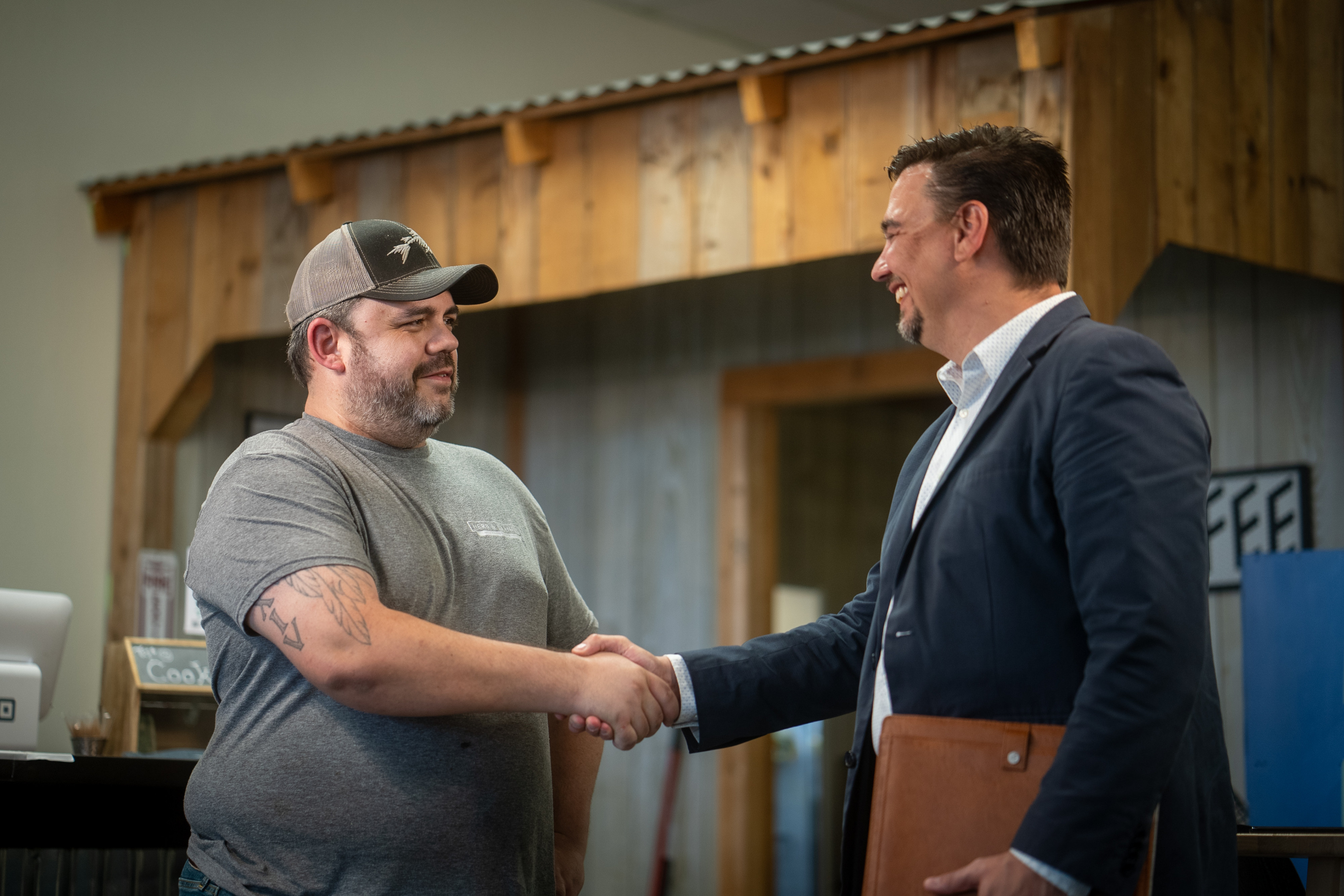 business owner shaking hands with a CCEDC team member