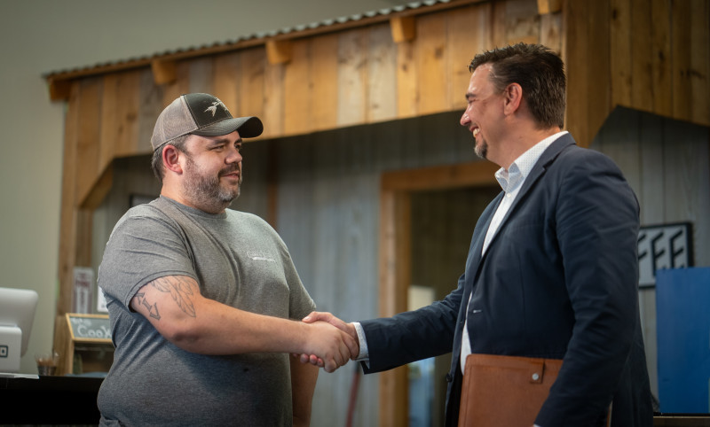 business owner shaking hands with a CCEDC team member