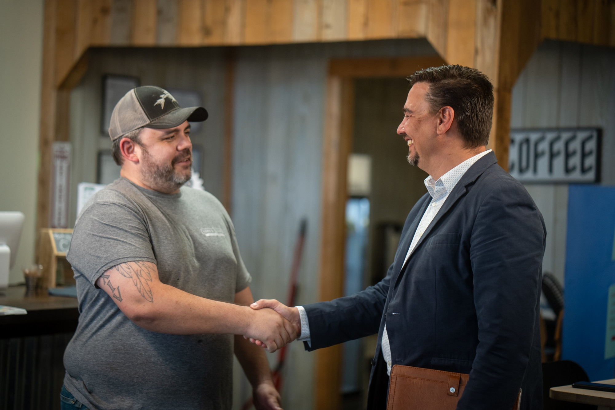 business owner shaking hands with a CCEDC team member