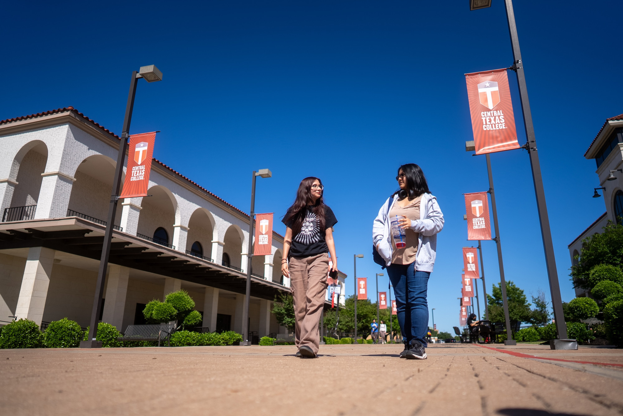 central texas college students walking on campus