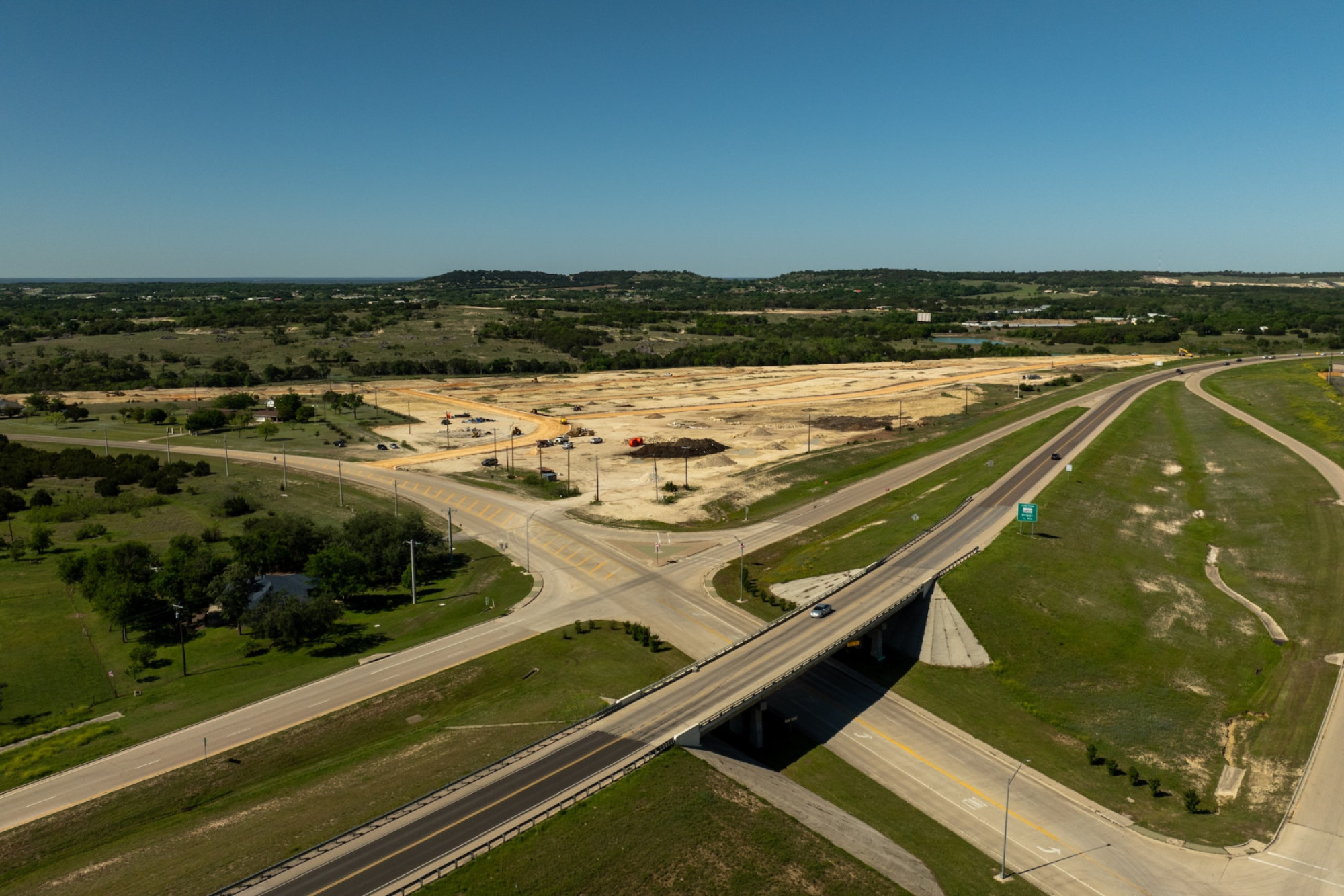 aerial view of land under development and accompanying highways